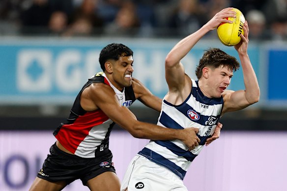 Connor O’Sullivan of the Cats is tackled by Nasiah Wanganeen-Milera of the Saints.
