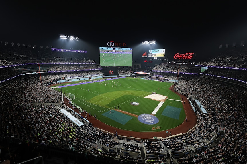 A wide shot of CitiField baseball stadium which has a soccer pitch on it