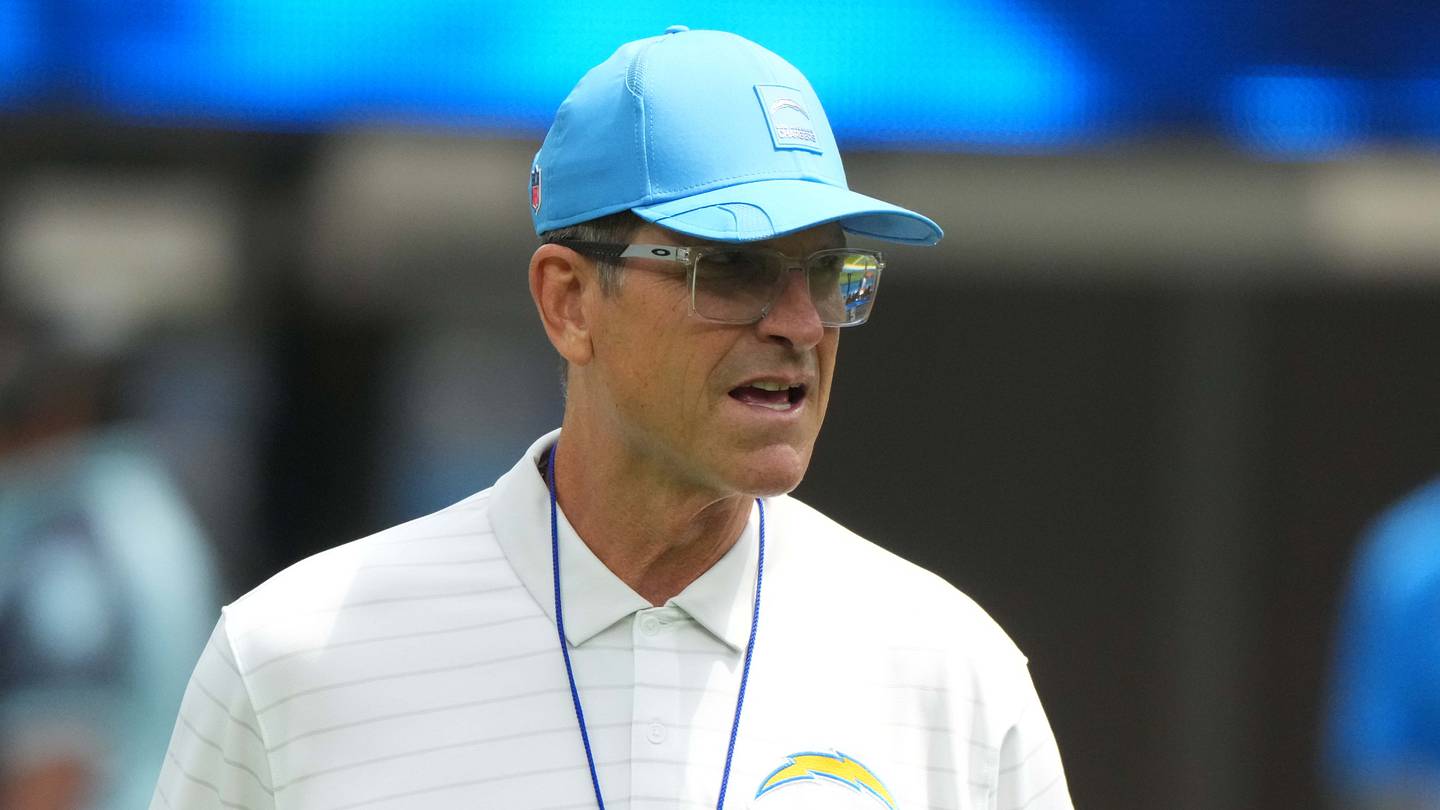 Aug 10, 2025; Inglewood, California, USA; Los Angeles Chargers head coach Jim Harbaugh reacts during the game against he New Orleans Saints at SoFi Stadium. Mandatory Credit: Kirby Lee-Imagn Images