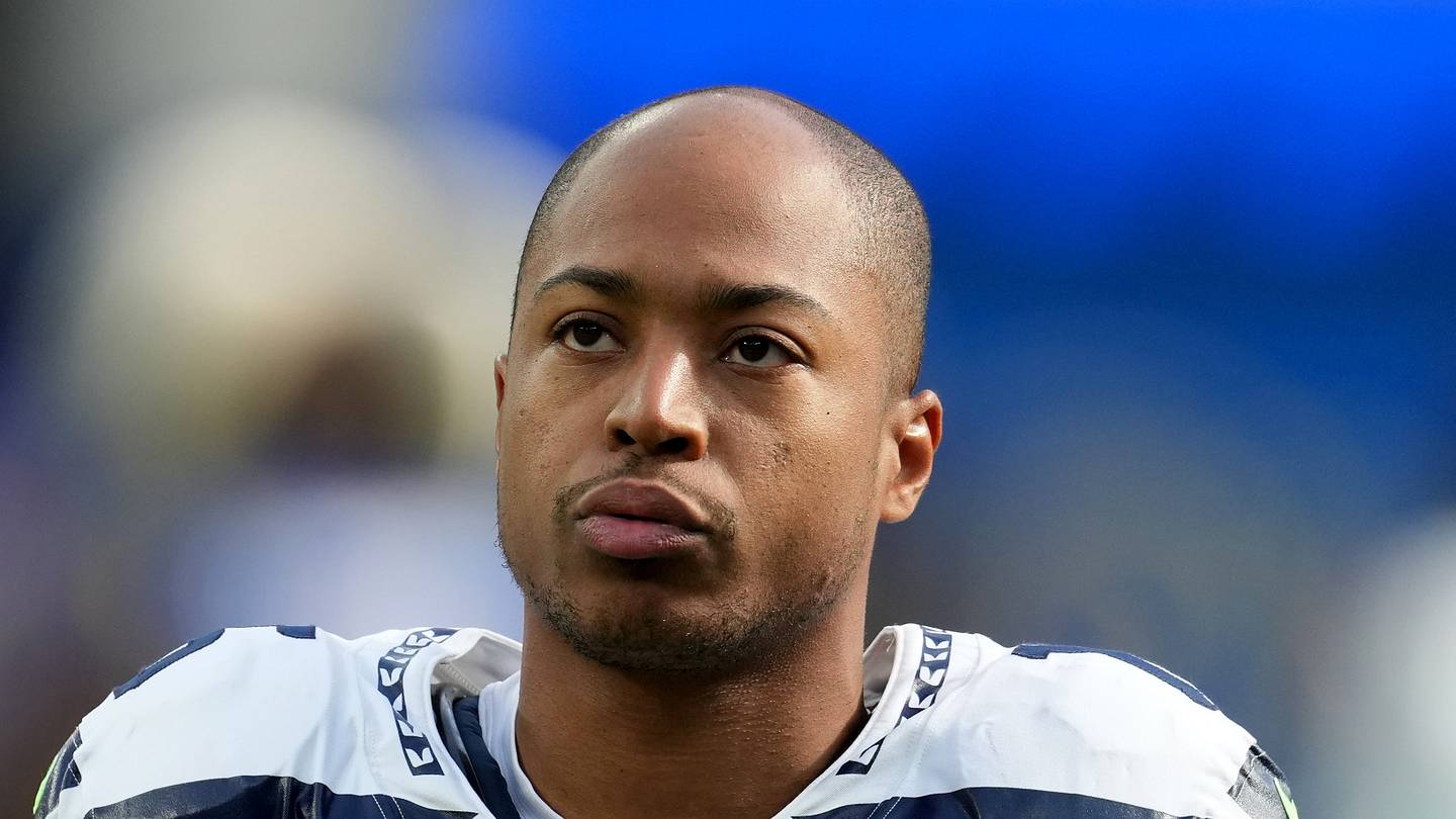 Former Seattle Seahawks wide receiver Tyler Lockett looks on