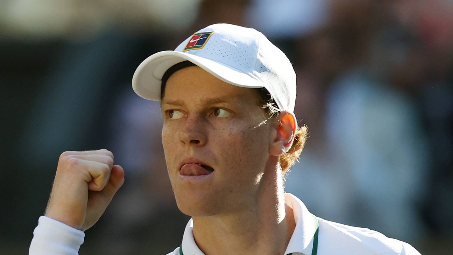 Jannik Sinner reacts after winning a point