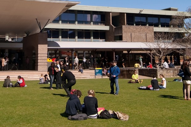 "Sydney, Australia - August 17, 2012: Students and graduates converge on a lawn before the University of New South Wales (UNSW) library on a clear winter morning."