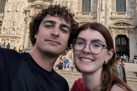 Lachie takes a selfie of himself in front of a church