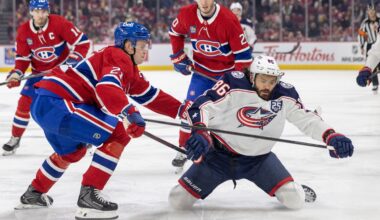 Canadiens defenceman Kaiden Guhle knocks down Columbus Blue Jackets forward Kirill Marchenko as Nick Suzuki, left, and Juraj Slafkovsky trail the play in Montreal on March 26.