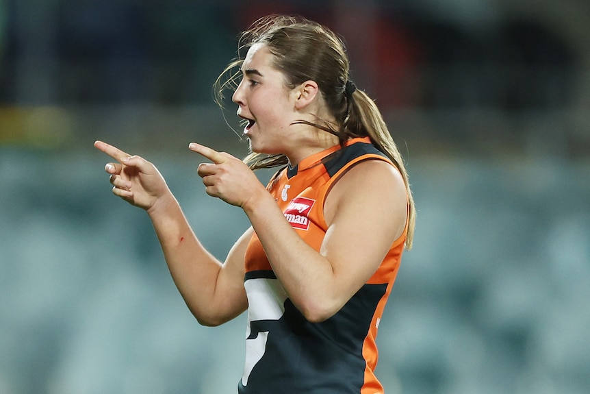 Zarlie Goldsworthy of the Giants celebrates kicking a goal.