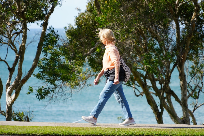 Woman looking around with windy hair