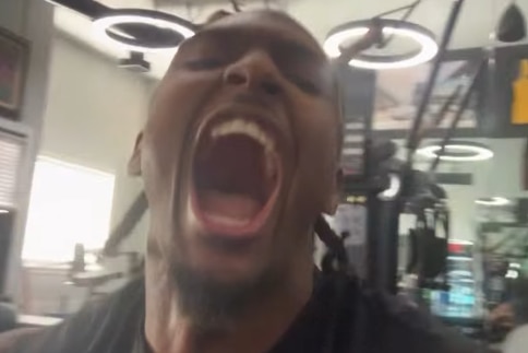 A close up of a Philly NBA star reacting excitedly by yelling into the camera.
