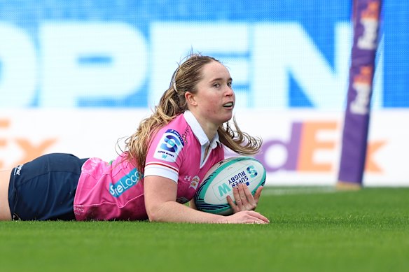 Tia Hinds of the Waratahs scores a try against the Force in the semi-final.