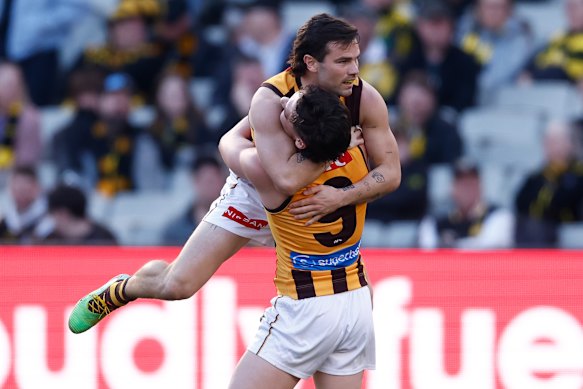 Connor Macdonald and Nick Watson celebrate the Hawks’ big win over Richmond.