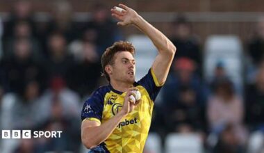 Kasey Aldridge bowling for Durham in the T20 Blast with his right hand holding the white ball and his left hand raised high for leverage