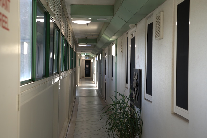 The white corridor of a tower block apartment building