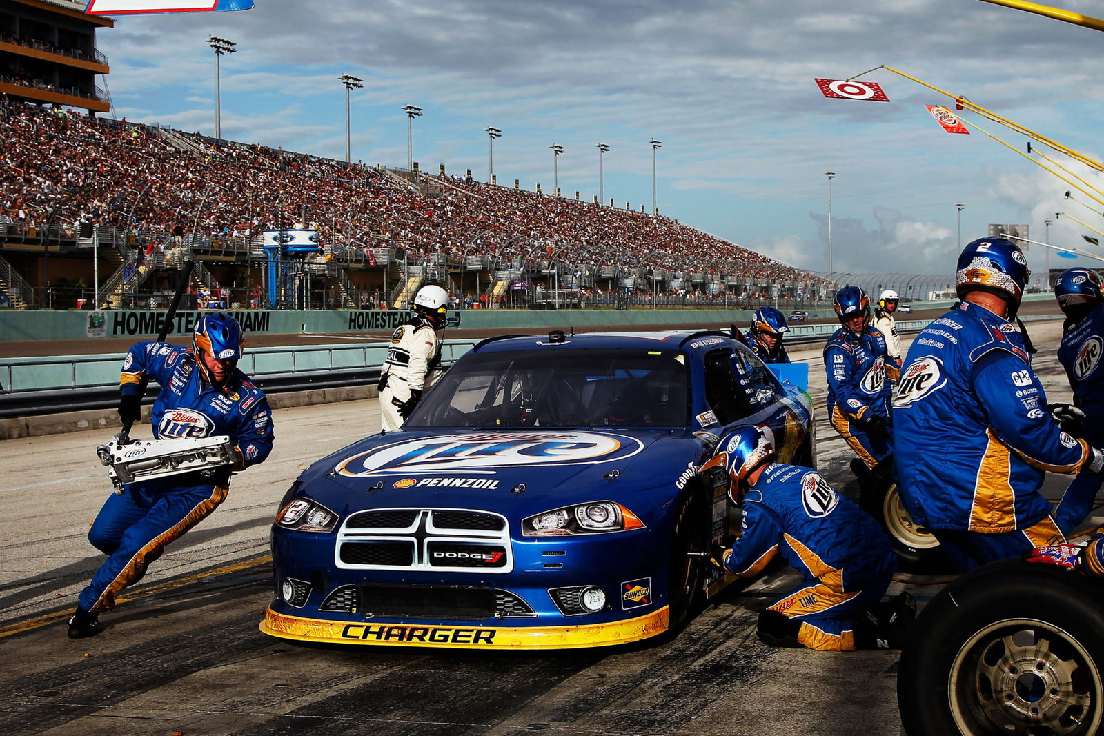 Team Penske performs a pit stop during the 2012 NASCAR Cup Series decider at Homestead-Miami Speedway.