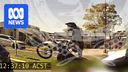 SA Police film electric motorcycle rider doing wheelie while attending another crash