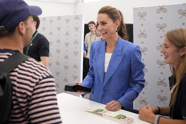 Catherine, Princess of Wales speaks to members of the public as they purchase tickets after queueing for entry as she helps out in the ticket office on day four of the 2026 Wimbledon Tennis Championships at All England Lawn Tennis and Croquet Club on July 2, 2026 in London, England. 