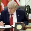 U.S. President Donald Trump signs an executive order at the White House.