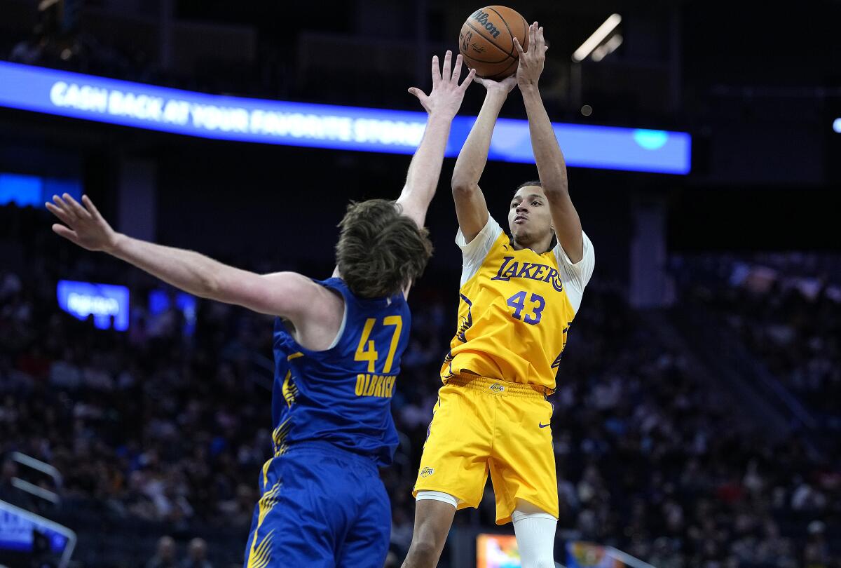Lakers rookie Cameron Carr shoots a three-pointer over Golden State's Lachlan Olbrich.