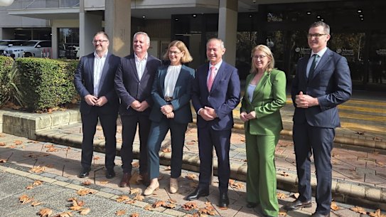 WA Premier Roger Cook, Treasurer Rita Saffioti, Health Infrastructure Minister John Carey and Health Minister Meredith Hammat with Bethesda Health Care Executive Director Neale Fong and Mount Hospital general manager Patrick Turner outside the hospital on Thursday.