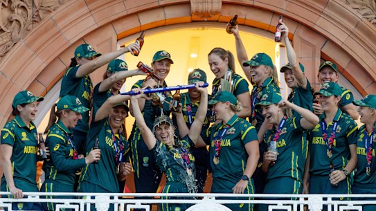 The Australian team celebrates on the balcony at Lord’s.