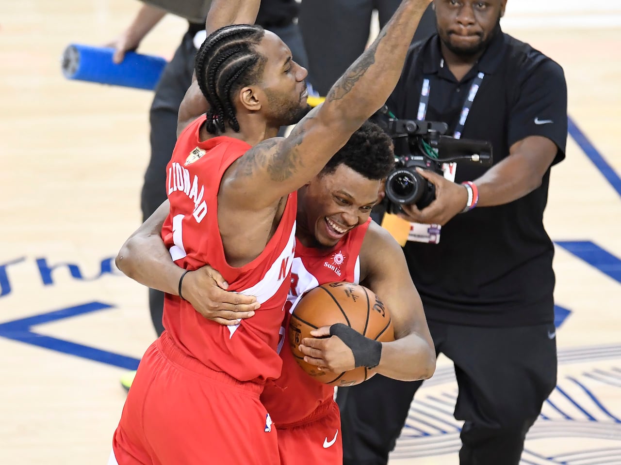 Kyle Lowry and Kawhi Leonard of the Toronto Raptors embrace after winning the NBA Championship