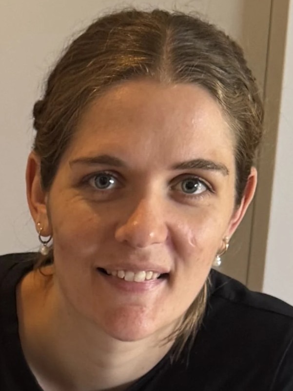 a close up image of a woman smiling