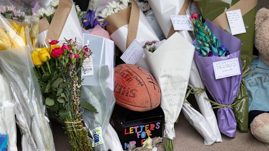 Flowers and other tributes laid for Nathan Fitzgerald at Mernda Central College, where he taught.