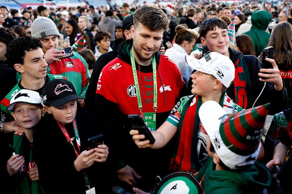Jai Arrow is mobbed by Rabbitohs fans.