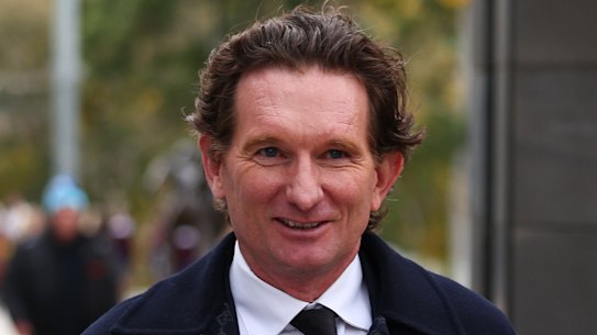 Former AFL player James Hird (left) and ex-Essendon chairman Paul Little arrive.