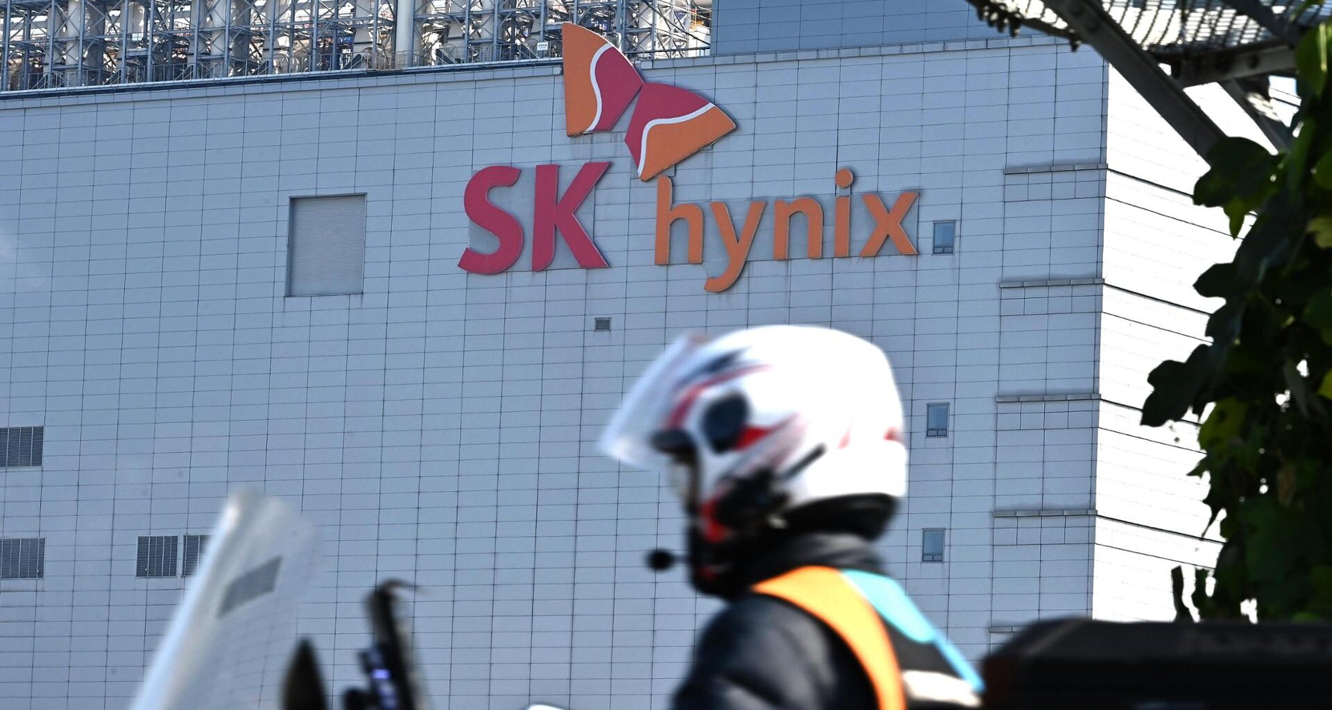 A delivery worker passes in front of an SK hynix chip plant in Icheon, Gyeonggi Province, in this file photo from Oct. 29, 2025. Chip giants