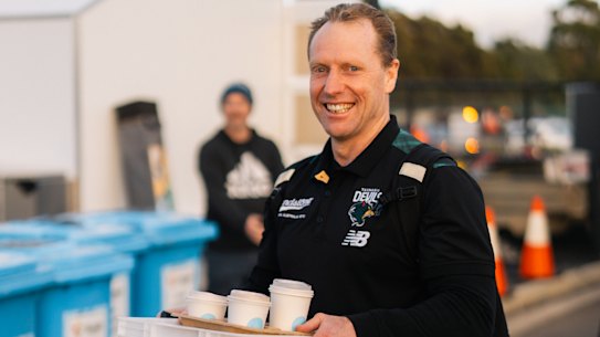 Matthew Knights does his beloved coffee run with the Tasmania Devils.