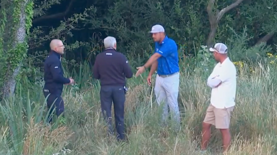 Bryson DeChambeau speaks with officials after his round on Friday at the British Open.