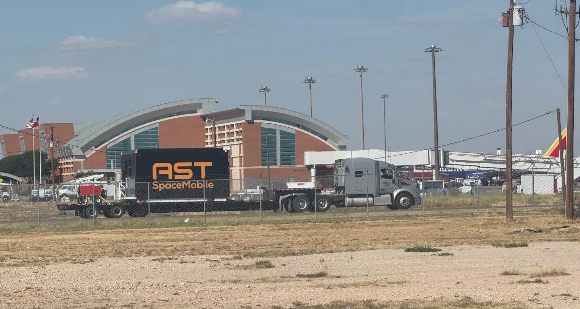 A large crate for the AST BlueBird satellites, framed against Midland International Airport terminal, last fall. AST and MDC are executing an economic development agreement leasing 23 acres of city property to AST for a 400,000 manufacturing facility that could ultimately hold at least 1,800 employees.