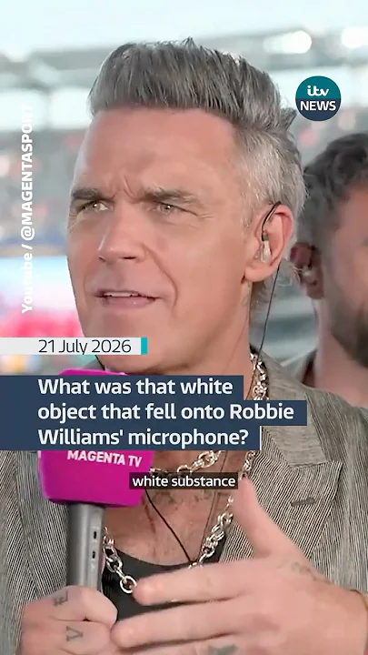 What was that white object that fell onto Robbie Williams' microphone? - YouTube