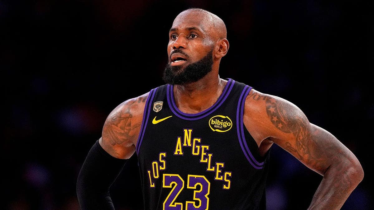 LeBron James stands on the court in Los Angeles.