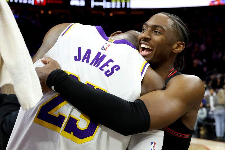 Philadelphia 76ers guard Tyrese Maxey embraces LeBron James after an NBA game as speculation grows about the four-time MVP potentially joining the Sixers.