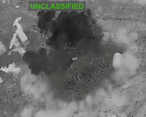 Scattered debris and smoke at an unknown location during what the US Central Command said were strike on Iran