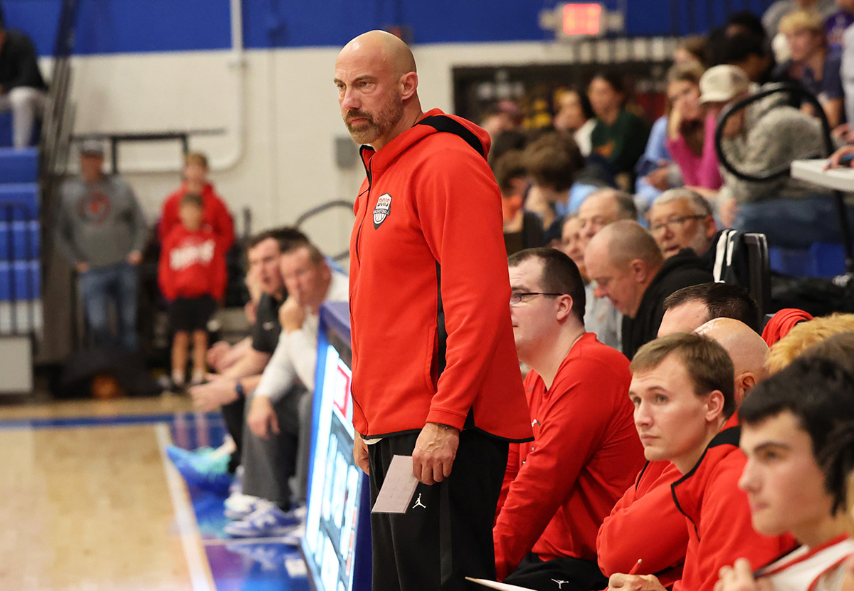 Staunton coach Ty Laux stands in front of his team's bench during a Nov. 26 game vs. Jersey at the Roxana Hoopsgiving Classic. Laux is the 2026 Telegraph Small-Schools Boys Basketball Coach of the Year.
