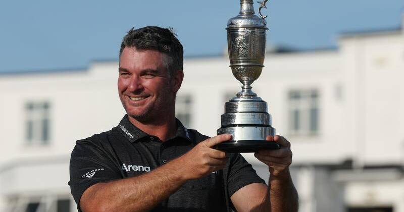 IT'S MINE: Ryan Fox was reluctant to share the trophy with his daughters on his return home. Photo: EPA PHOTO