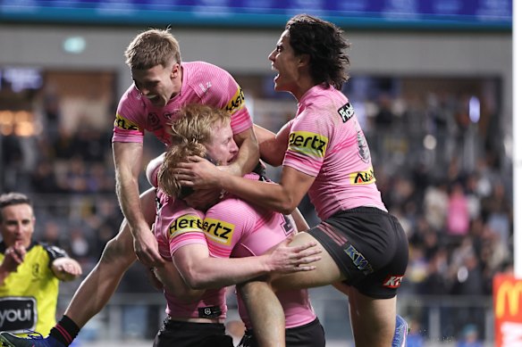 Penrith celebrate a Tom Jenkins try against the Eels.