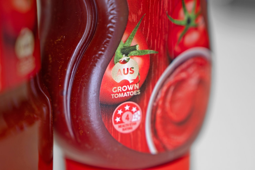 An "Australia grown" tomato paste label on a Leggo's tomato paste bottle.