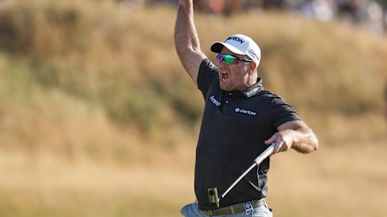 Ryan Fox of New Zealand celebrates on the 18th green after winning the British Open.