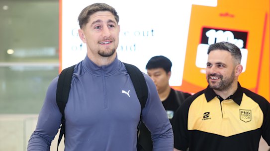Zac Lomax touches down in Sydney on Monday night with PNG Chiefs’ football manager Michael Chammas.