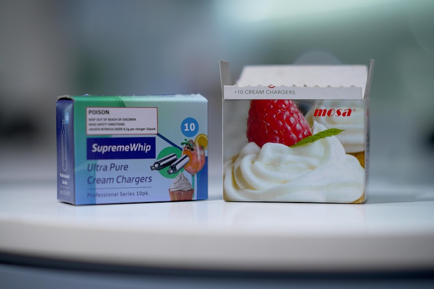 Two small cardboard boxes, one with the words "Supreme Whip" on it.