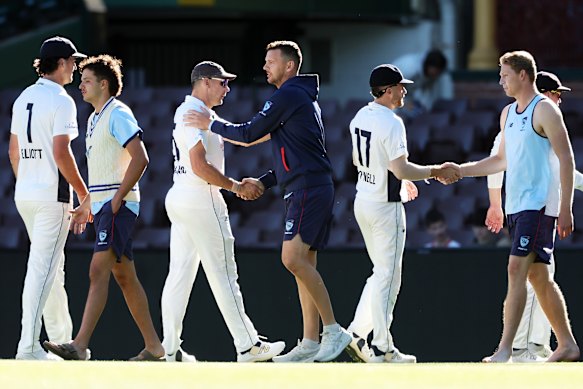 Josh Hazlewood shakes hands with Scott Boland after their Sheffield Shield match at the SCG last summer.