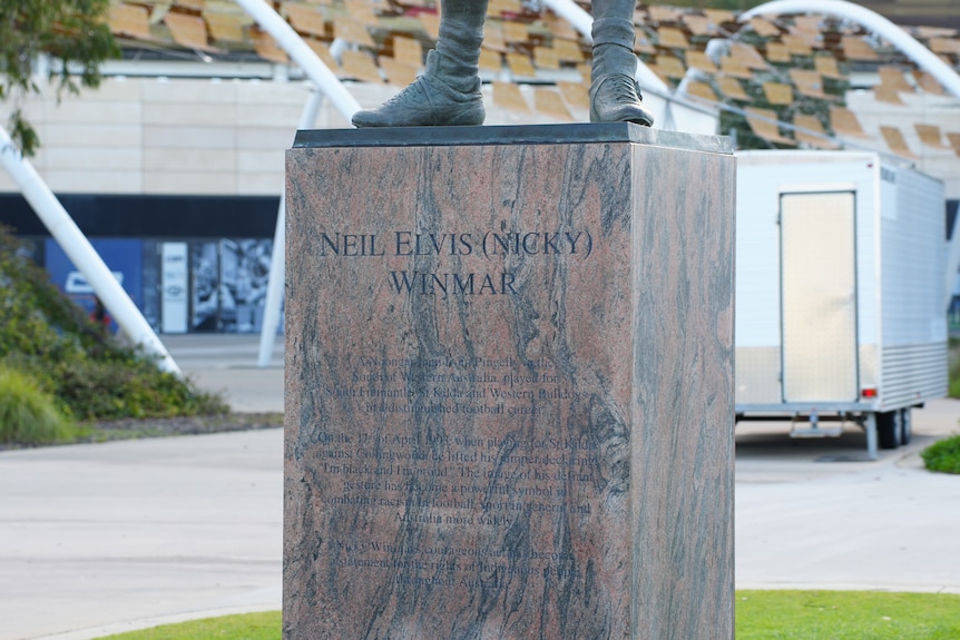 Bronze statue of Nicky Winmar at Perth Stadium.