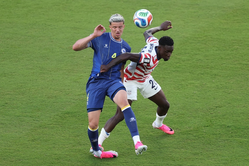 Folarin Balogun steps on Tarik Muharemovic's ankle during a soccer match