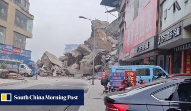 Rescuers in China race to reach residents trapped by landslide that has killed 8 people