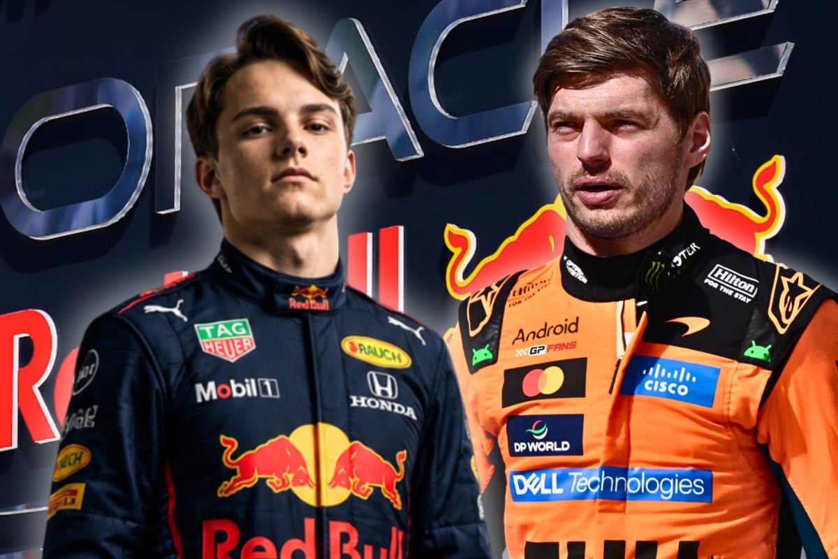Piastri in navy Red Bull race suit next to Verstappen in papaya McLaren race suit with Red Bull Racing sign and logo as background