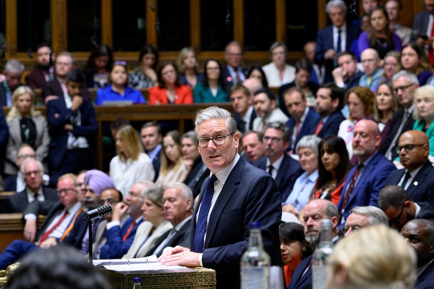 Keir Starmer is standing up to speak, in a packed House of Commons.
