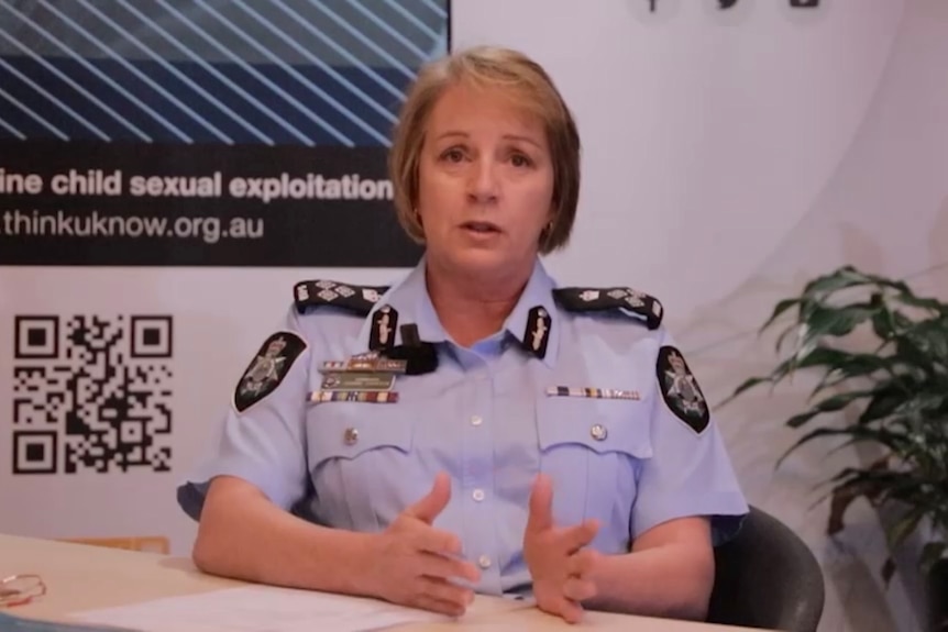 Female police officer with blonde bob.