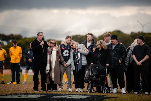 Nathan Fitzgerald’s father, Gary (far left), speaking at a memorial for his son at Epping Football Club’s home ground.
